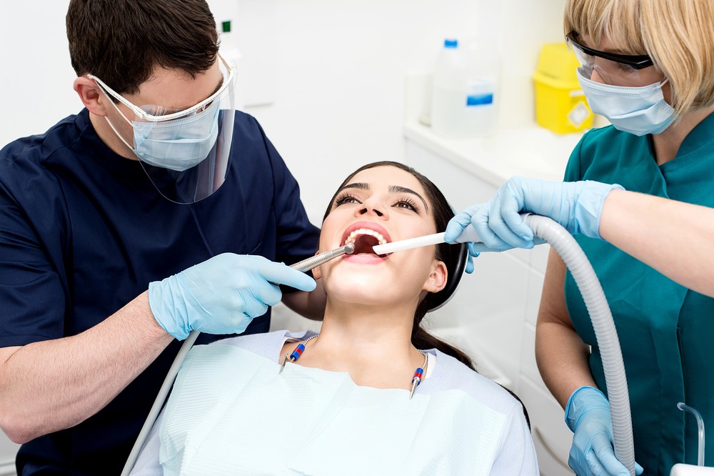 Orthodontist treating a patient